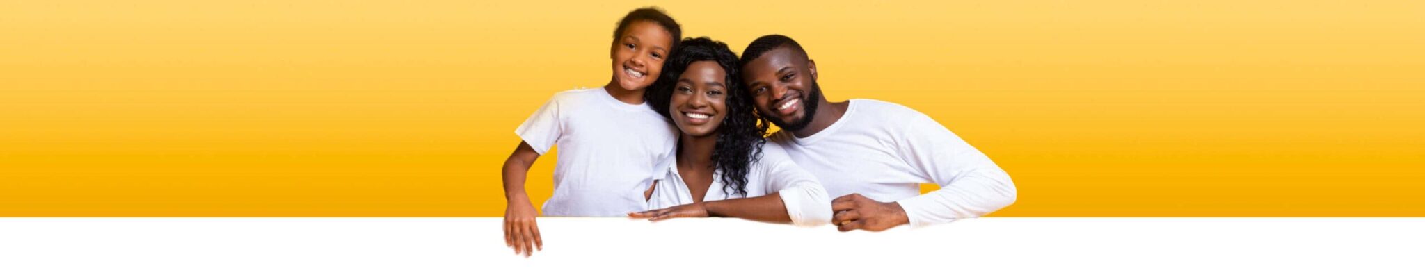 family Smiling family of three—an adult woman, an adult man, and a young girl—posing together against a yellow background, all wearing white shirts.